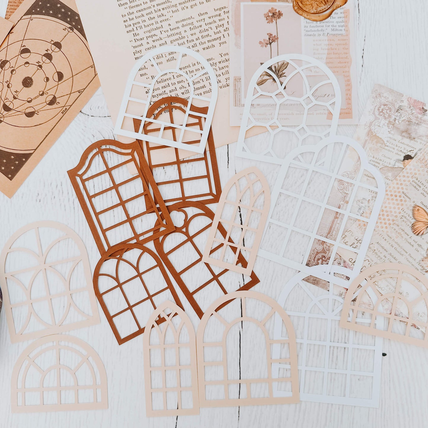 Intricate paper cutouts - Neutral colour windows