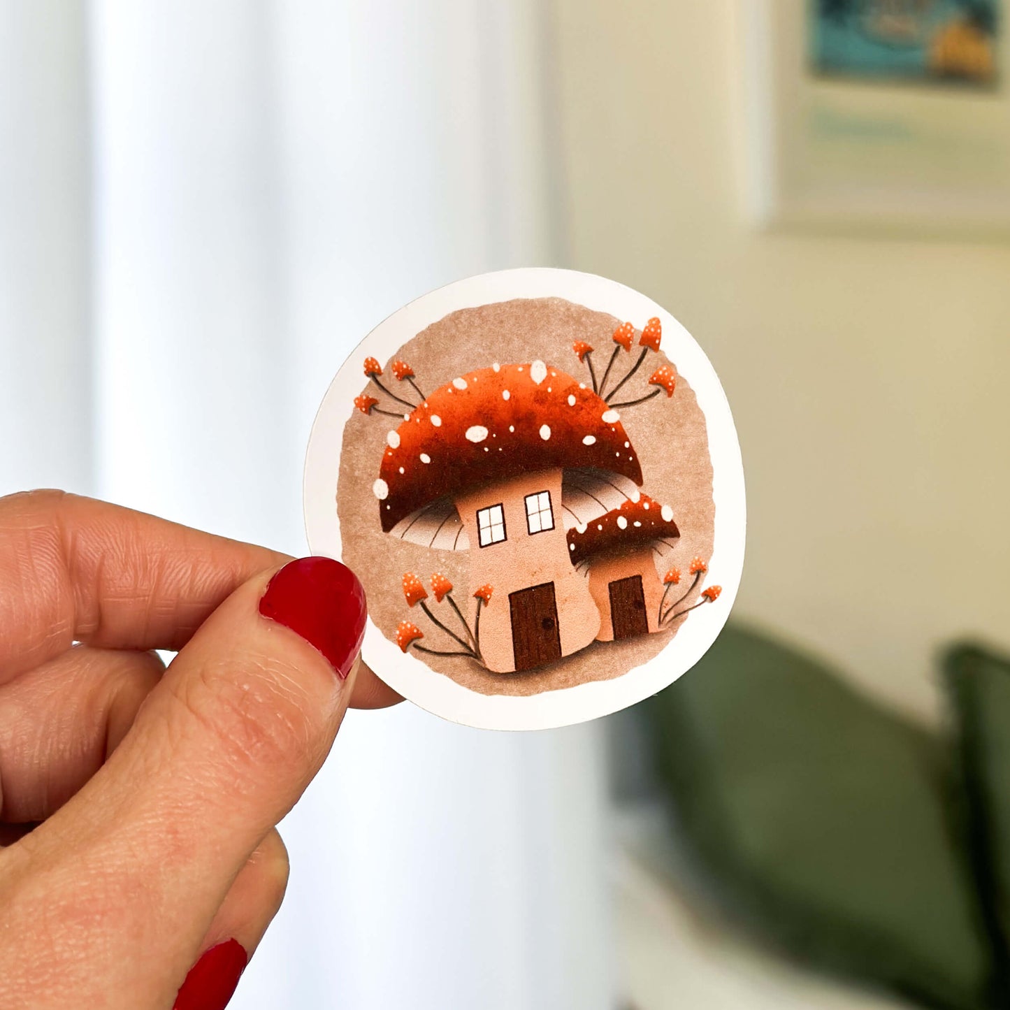 1 large mushroom illustrated sticker with smaller mushrooms growing.