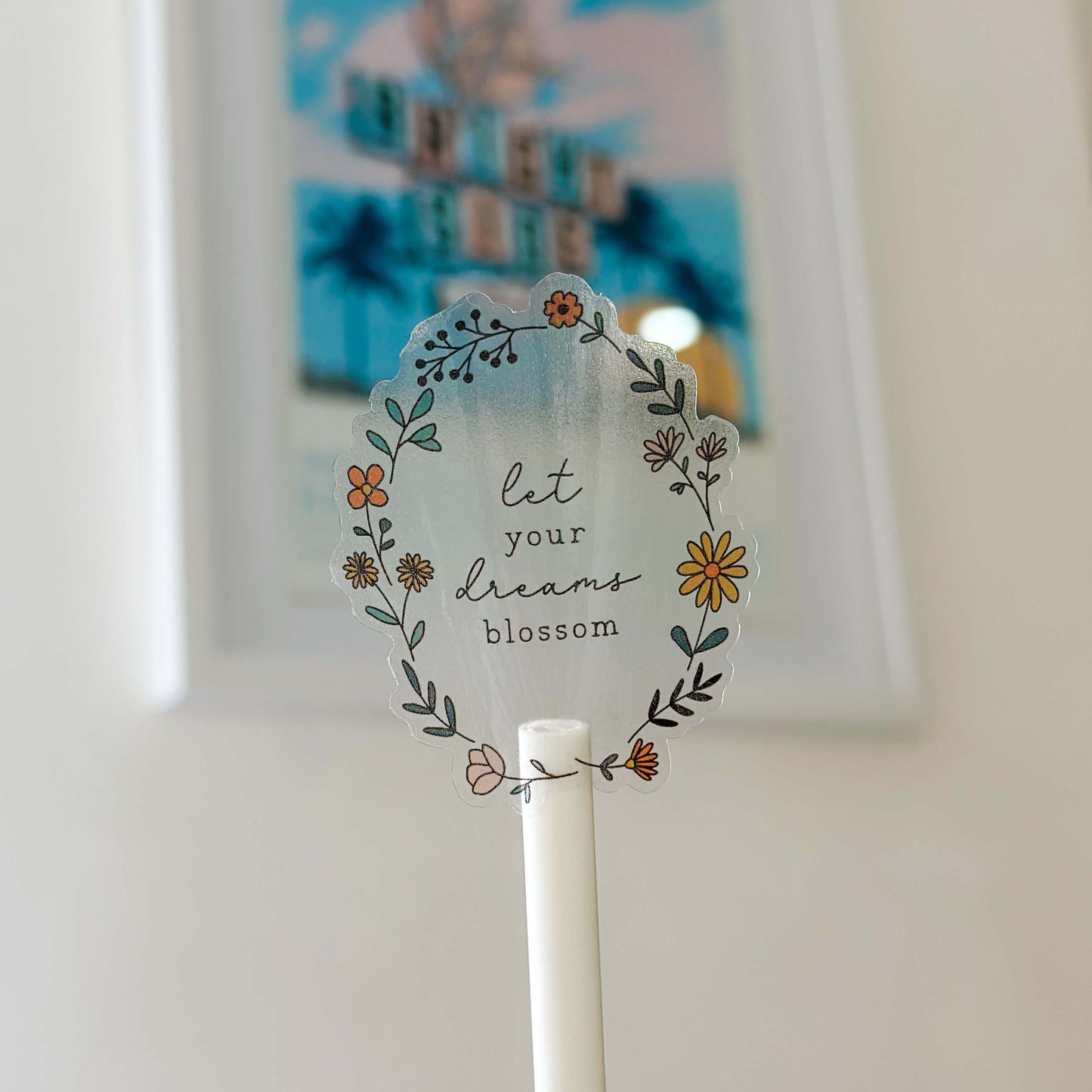 vinyl sticker with flower illustration and the words 'et your dreams blossom;
