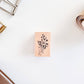 Mini wooden flower stamp on table