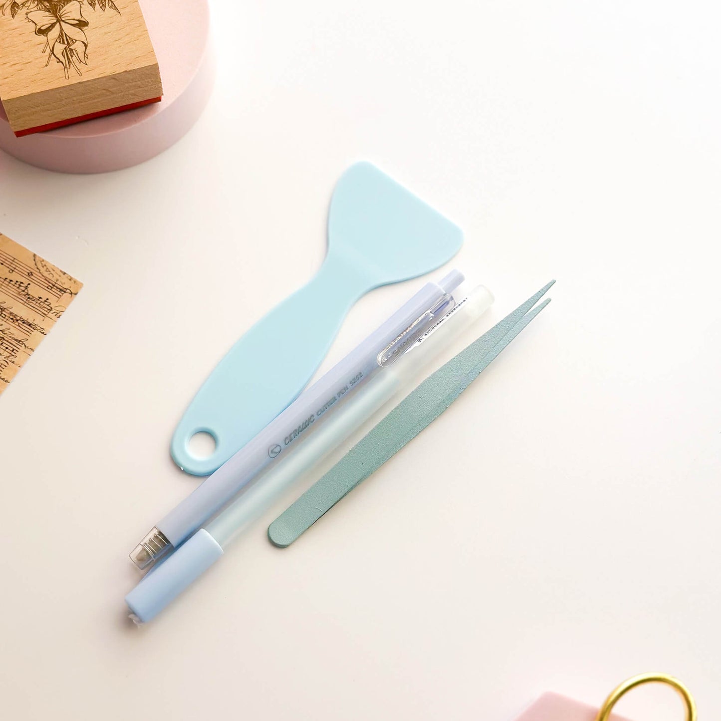 Tool set with tweezers, cutter and glue pen