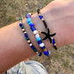Blue beaded bracelets with black starfish charm