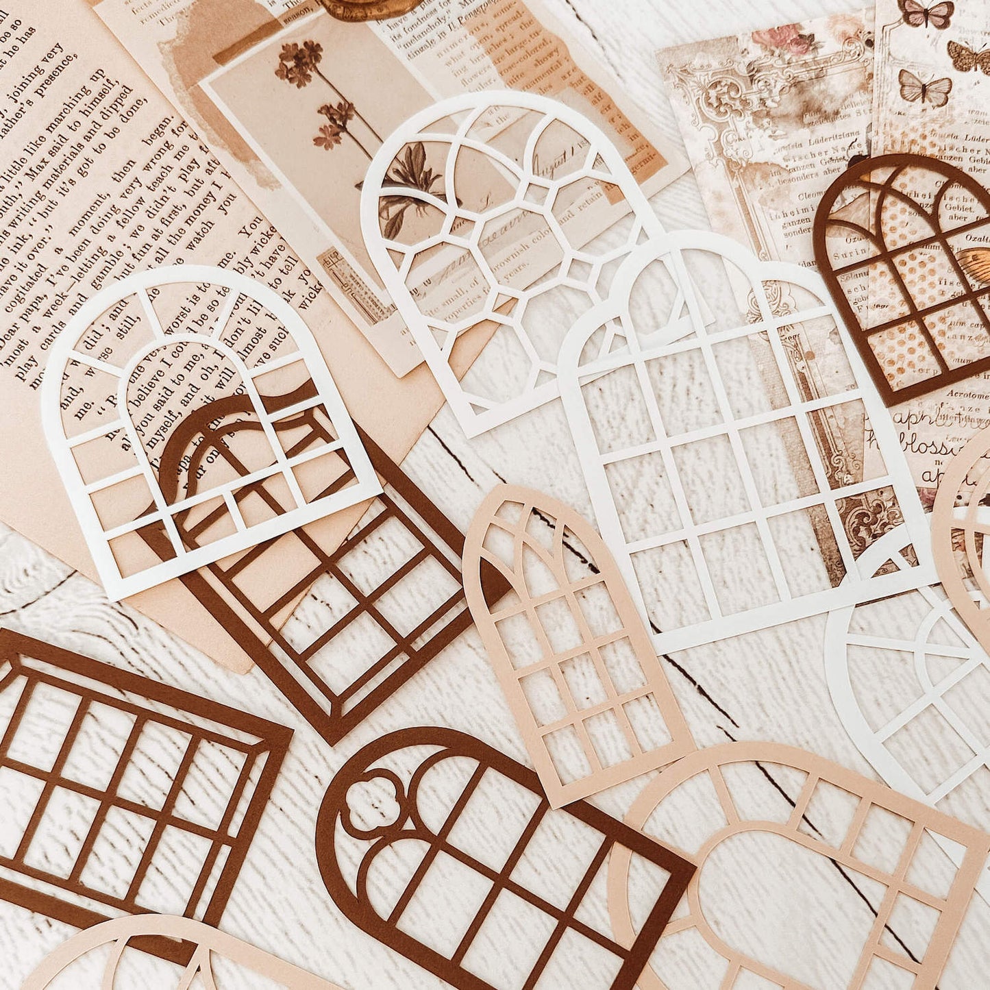 Intricate paper cutouts - Neutral colour windows