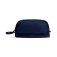 A navy blue rectangular toiletry bag with a top zipper, a bottom zippered compartment, and a small carrying loop, shown on a plain white background.