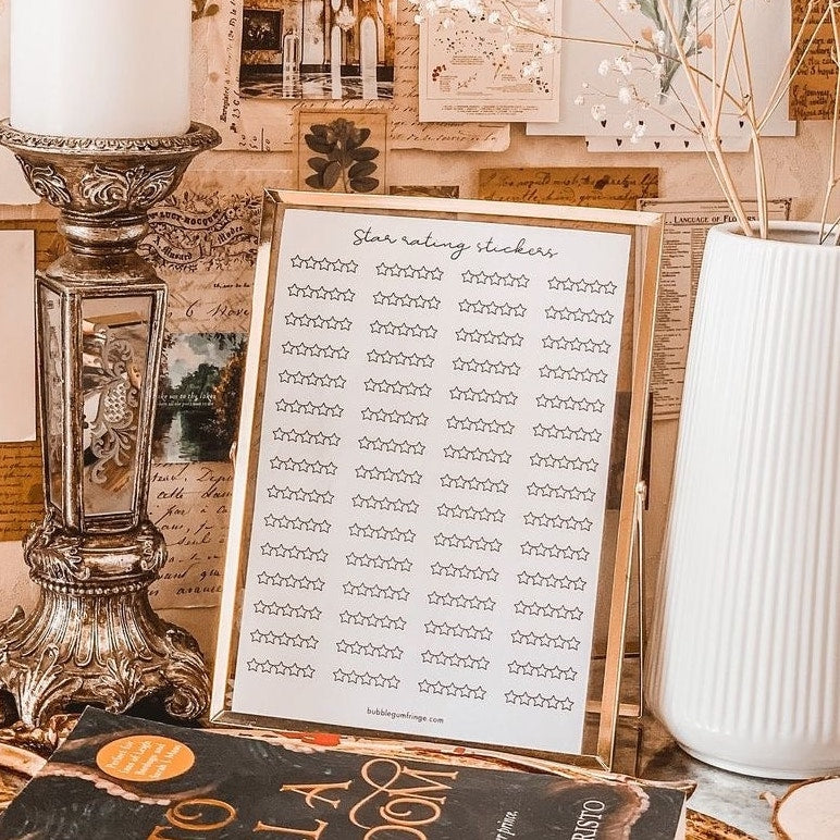 star rating sticker sheet in gold frame on table