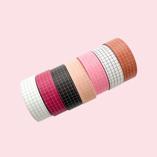7 rolls of washi tape with grid design, different colours.