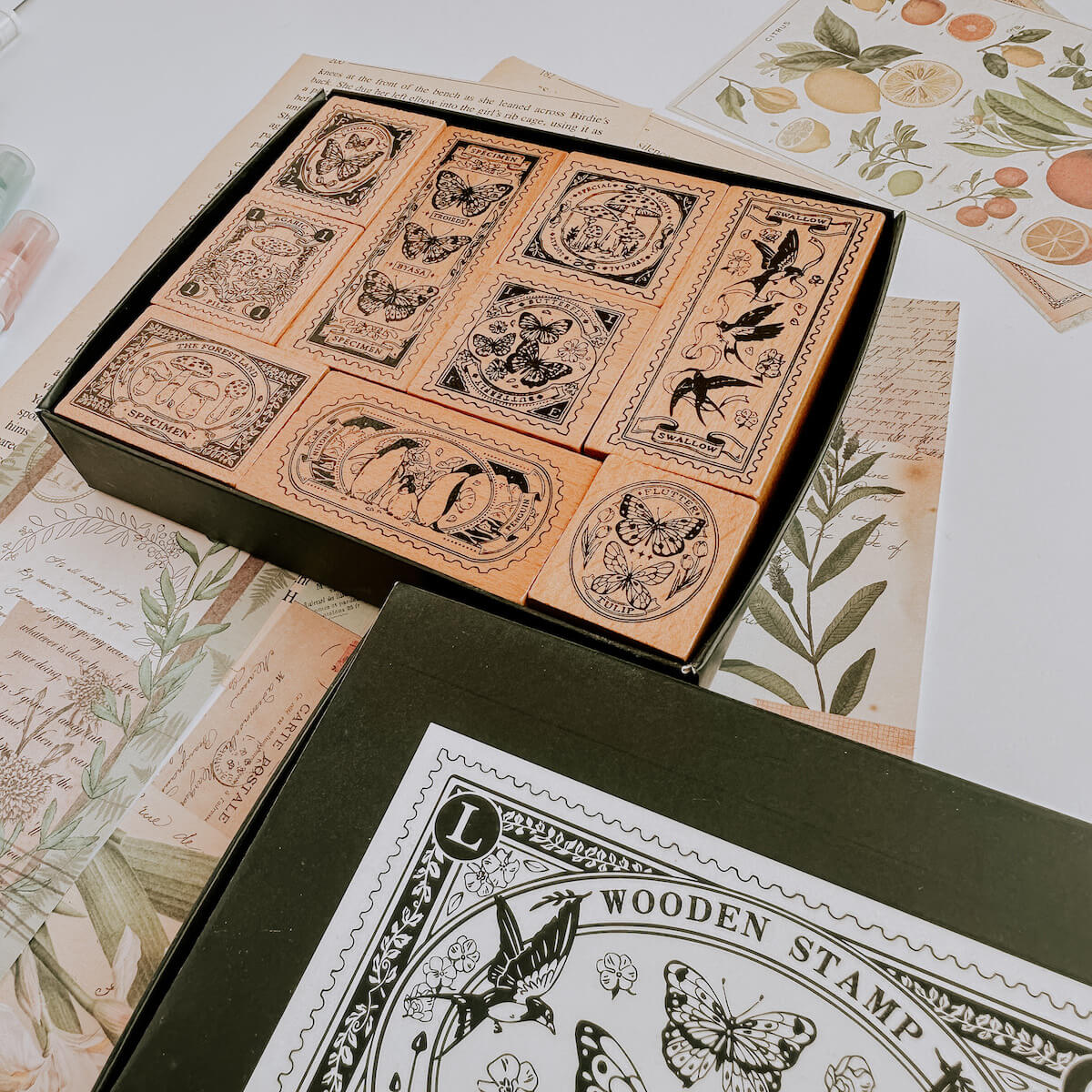 Wooden stamp set with butterflies, penguins and mushroom designs