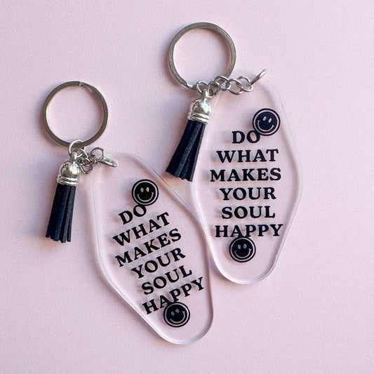 Acrylic keychain with text 'do what makes you happy' in black