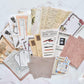 Decorative papers with illustrations of pens and music sheets.Art & bookish mega ephemera bundle - 260 pcs paper detail